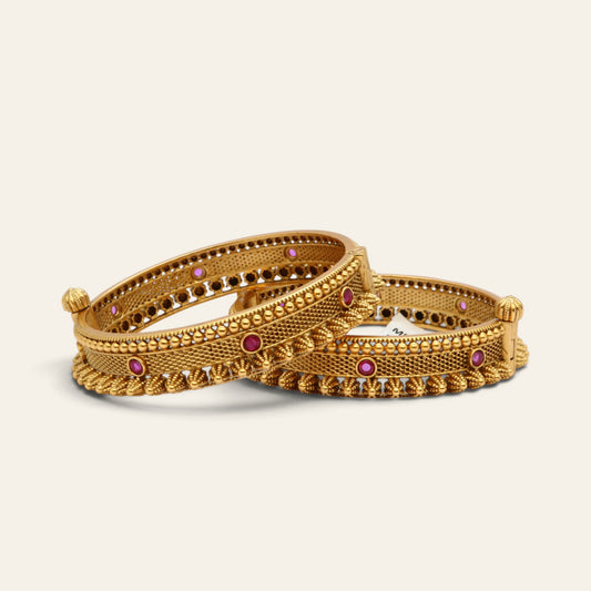 Pair of antique gold kada bangles for women with red stones and beaded borders