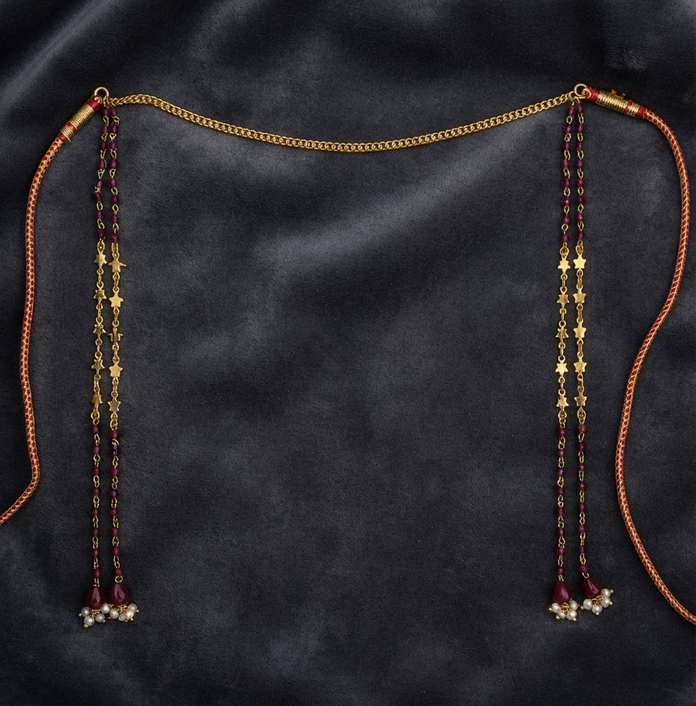 Gold plated crystal stone Mundavalya with red drops and pearl clusters on dark velvet, traditional Maharashtrian bridal jewellery
