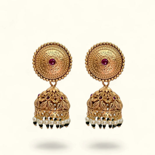 Gold plated jhumka earrings for women with floral round top, red stone and pearl drops – front view