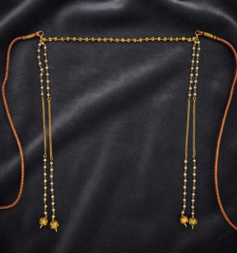 Gold plated moti Mundavalya with pearl strands and gold ball drops on dark velvet – handcrafted in Satara, India