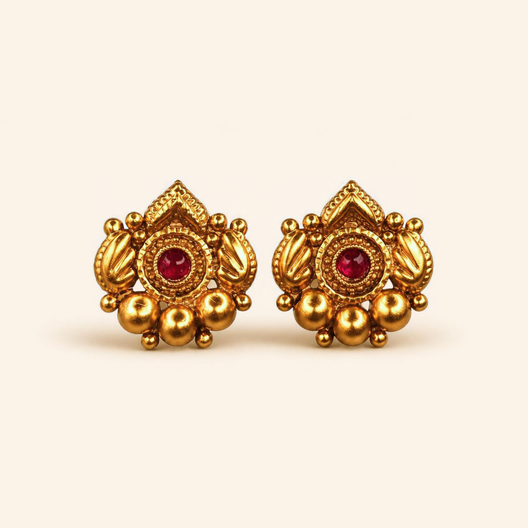Gold plated lotus stud earrings with ruby centre, matching the Hirkani thushi necklace set