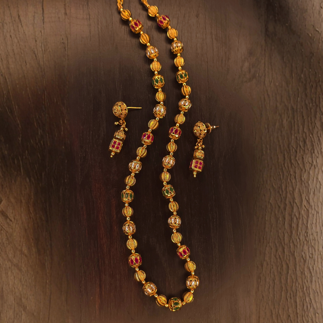 Antique gold plated meenakari bead necklace set with drop earrings on dark wood – Jija Jewellery