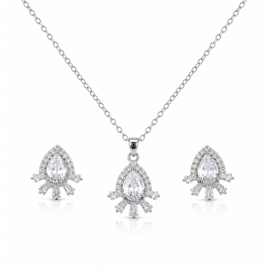 Close-up of silver-tone pear-cut cubic zirconia halo pendant with baguette crystal accents