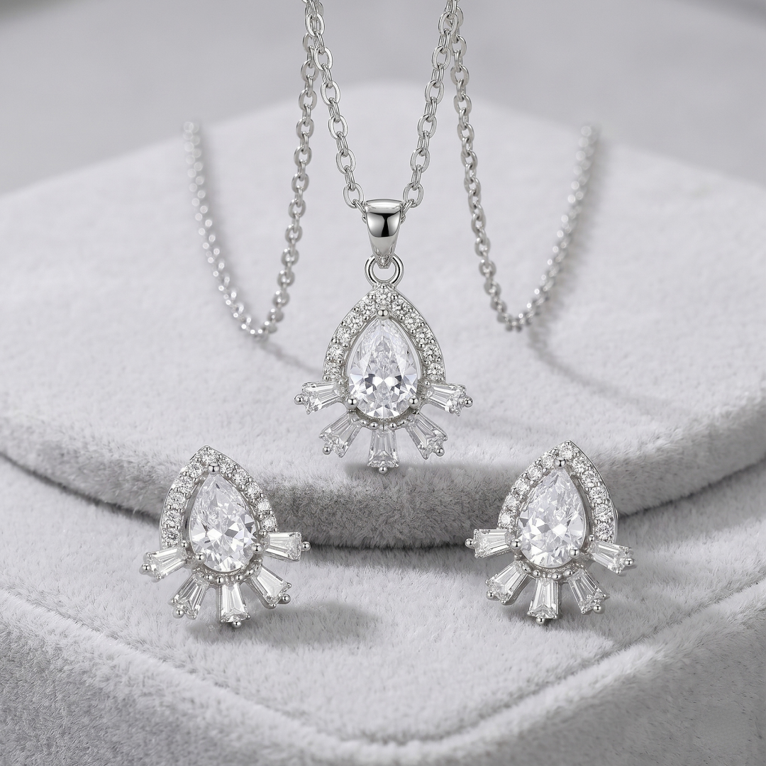 Matching silver teardrop halo CZ stud earrings styled for weddings and festive wear