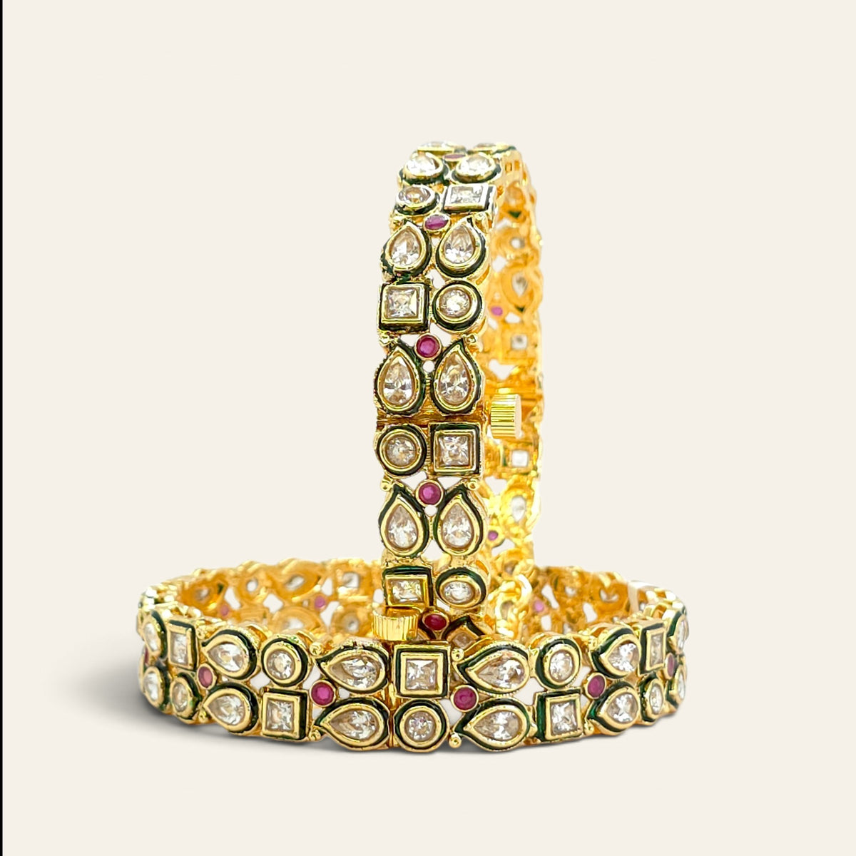 Close-up of Kundan bangle with ruby stones and green enamel meenakari detailing