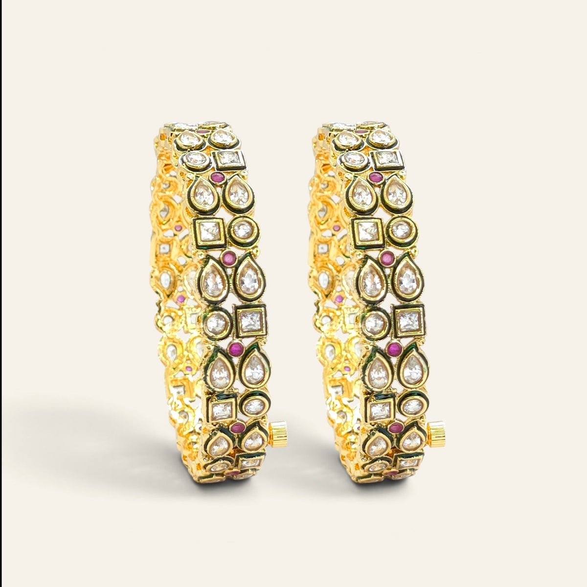 Pair of Kundan gold plated bangles with ruby and meenakari detailing, front view