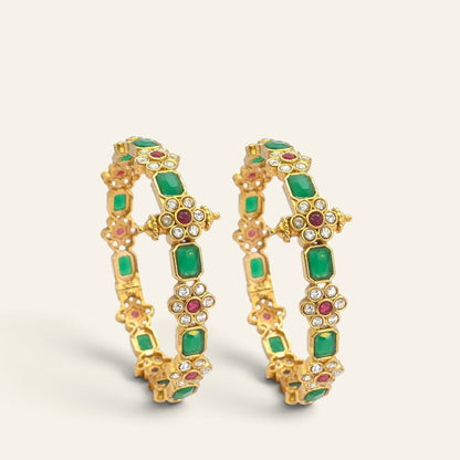 Emerald green floral ruby gold plated bangles, pair standing upright side view