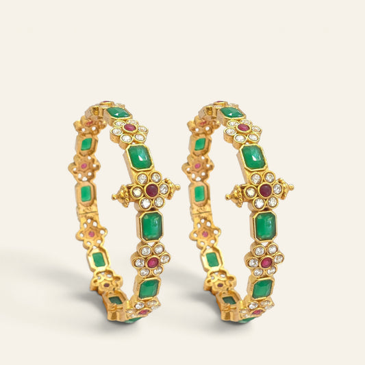 Close-up of emerald green floral ruby gold plated bangle showing cross medallion detailing