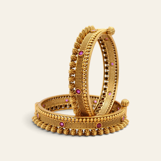 Antique gold plated kada bangle with red stones and latkan hanging charms