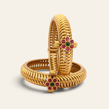 Gold-plated kada bangles with kundan floral accents and screw-openable closures