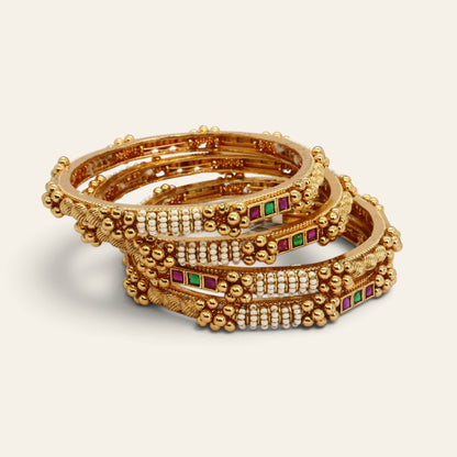 Set of 4 gold-tone bangles studded with pearls and red and green stones, stacked – Jija Jewellery