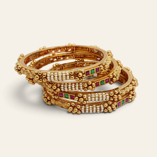 Set of 4 gold-tone bangles studded with pearls and red and green stones, stacked – Jija Jewellery