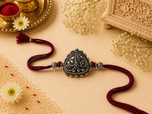Traditional oxidised rakhi for brother in skin-friendly nickel-free metal with antique finish and adjustable thread, handmade by Jija Jewels in Satara