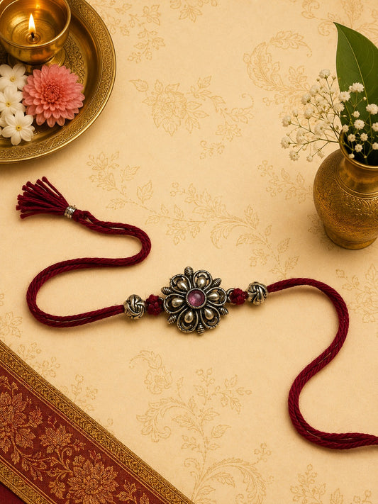 Mogra jasmine flower oxidised rakhi with antique finish in skin-friendly nickel-free metal, adjustable thread, handmade by Jija Jewels in Satara