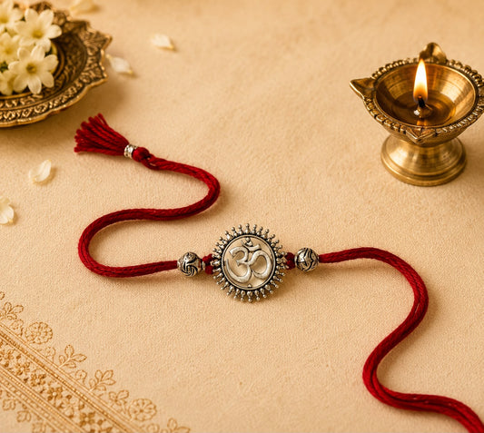 Omkar Om symbol rakhi with oxidised antique finish in skin-friendly nickel-free metal, adjustable thread, handcrafted by Jija Jewels in Satara
