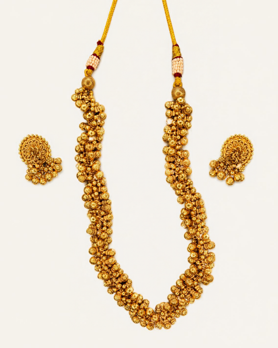 Gold plated ghungru necklace set with matching floral ghungru stud earrings on white background – Jija Jewellery