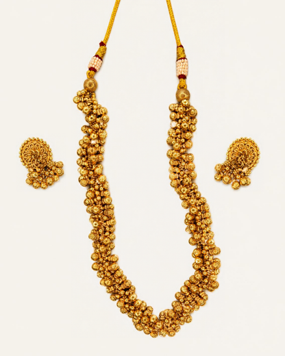 Gold plated ghungru necklace set with matching floral ghungru stud earrings on white background – Jija Jewellery
