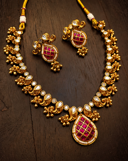 Traditional gold plated bridal necklace set with ruby-pink Meena work