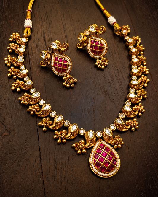Traditional gold plated bridal necklace set with ruby-pink Meena work