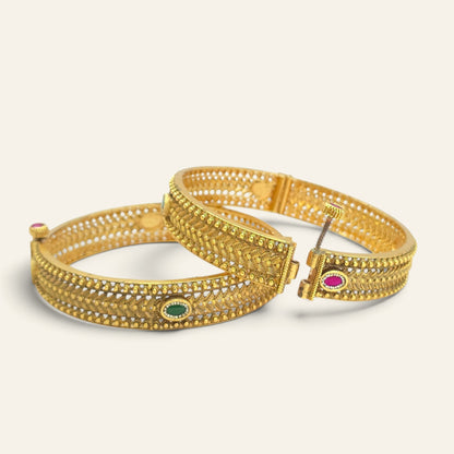 Antique gold plated Kada bangles with emerald stone detailing, handcrafted finish