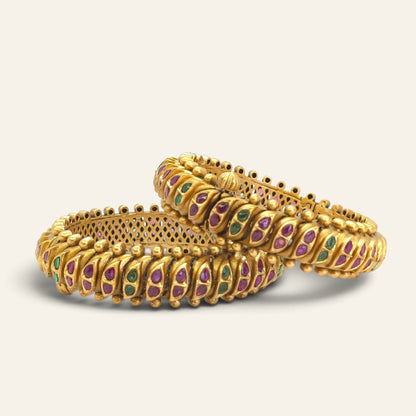 Antique gold look openable kada bangles stacked, showing beaded borders and stone work