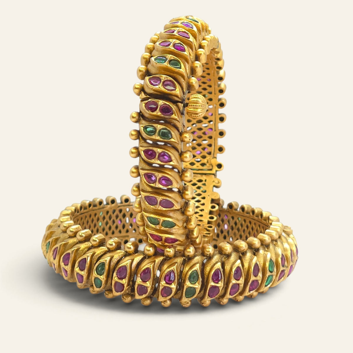 Pair of antique gold look kada bangles with semi-precious stones and beaded borders