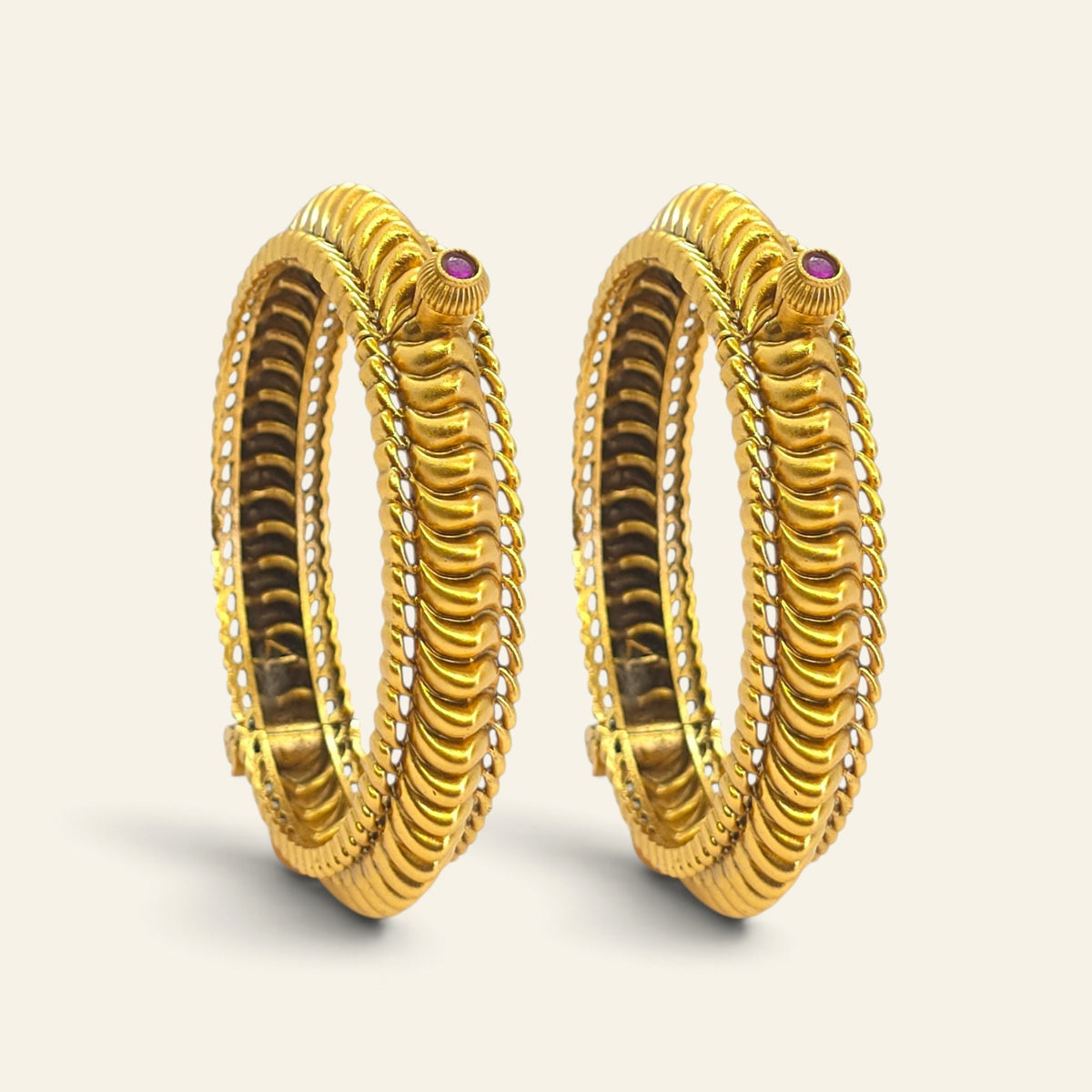 Gold-plated Shindeshahi Tode bangles showing the detailed ridged design and openable construction