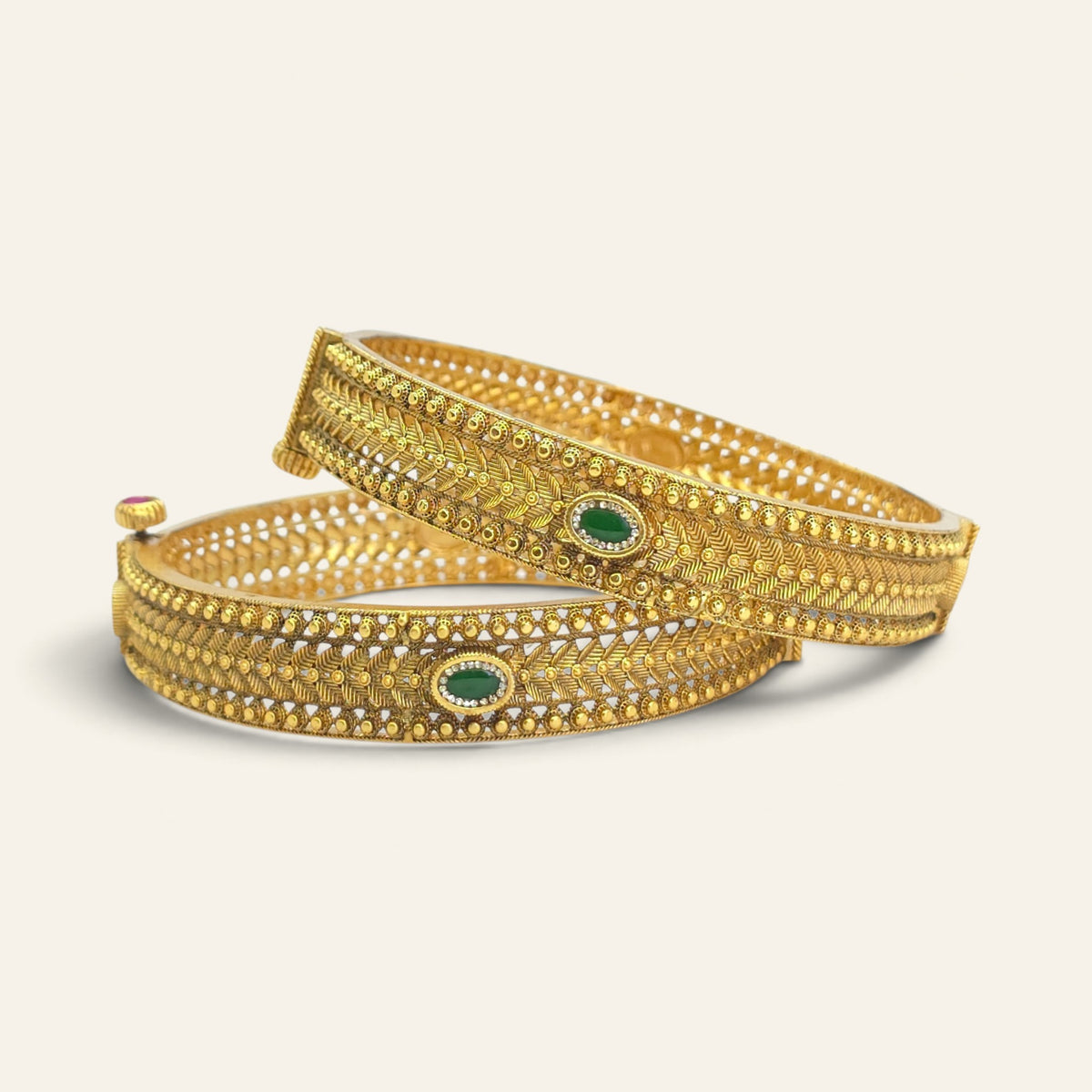 Pair of antique gold plated Kada bangles with ruby and emerald stones, openable screw fitting design