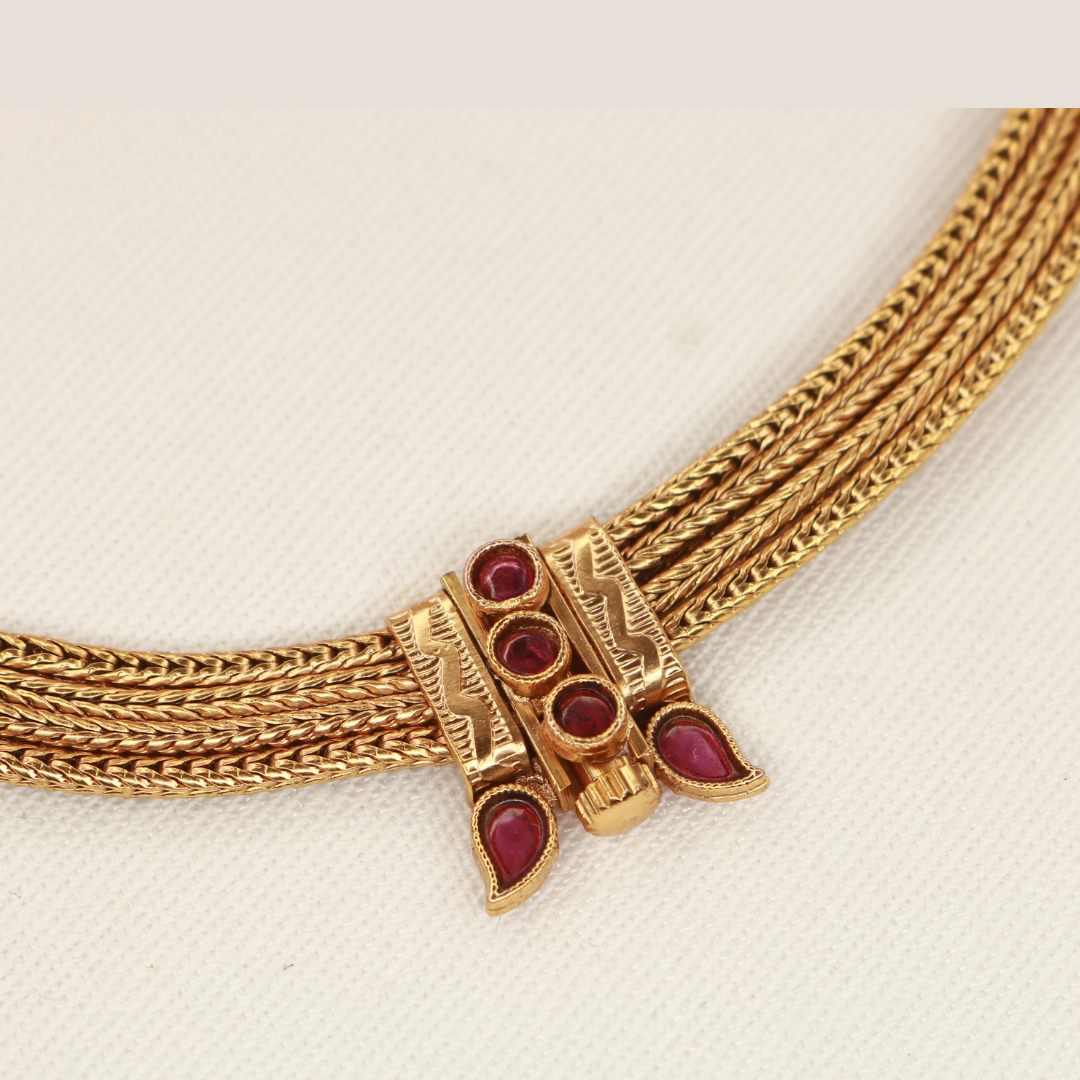 Chitaag necklace front-opening clasp detail with ruby-red round and teardrop stones