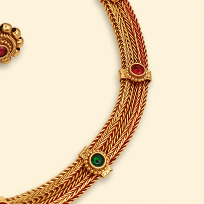 Close-up of antique gold wheat chain dori choker with ruby and emerald cabochon stone stations - Jija Jewellery