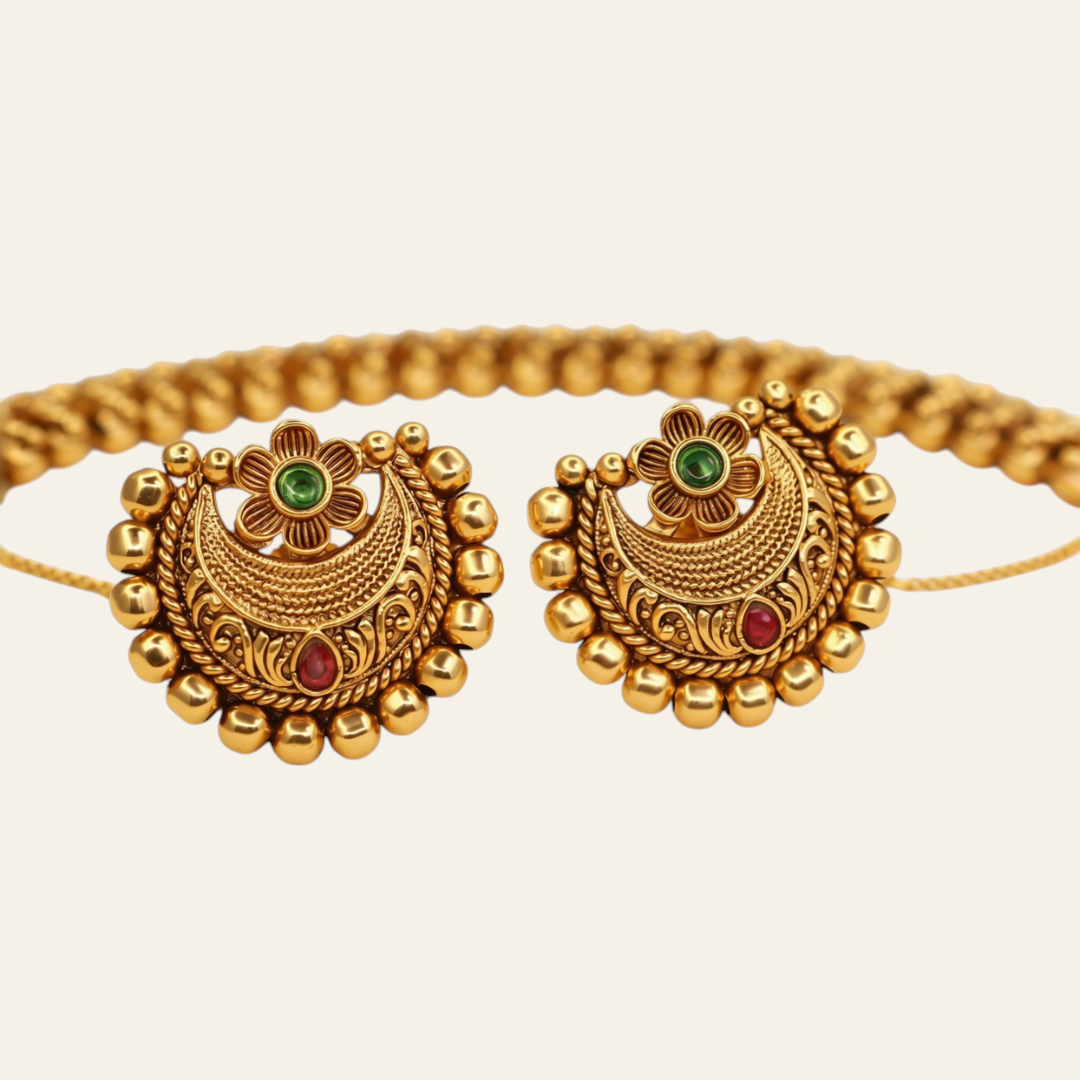 Chandbali stud earrings antique gold with emerald top and ruby base and gold bead petal border - close-up
