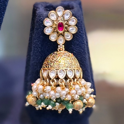 Matching pink Kundan jhumki earrings from the PadmaRatna bridal choker necklace set
