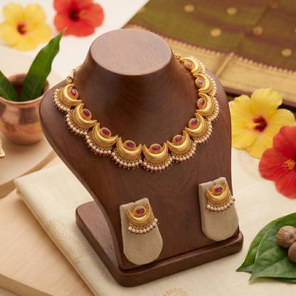 Close-up of Chandrakor crescent moon motif showing fine gold-tone detailing on the Maharashtrian necklace