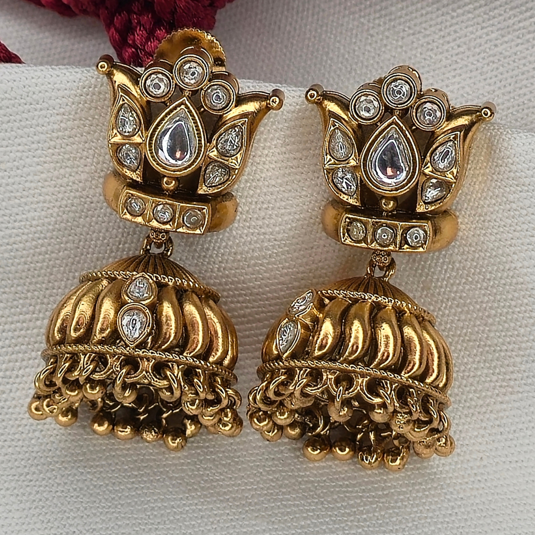 Shinde Shahi antique gold Jhumka earrings front view with lotus stud top