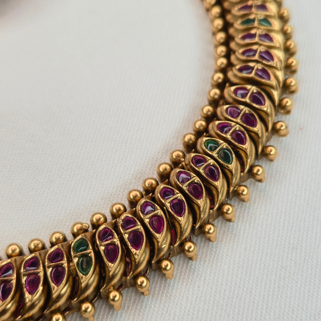 Full view of Shinde Shahi Kemp Choker necklace arc with ruby and emerald inlay