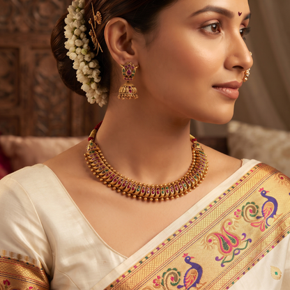 Shinde Shahi Kemp Choker Necklace Set with Jhumka Earrings on maroon velvet tray