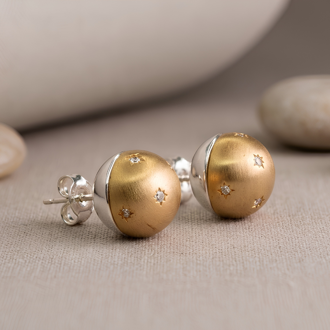 Model wearing gold dome stud earring with star-set CZ accents, celestial anti-tarnish ball stud by Jija Jewellery