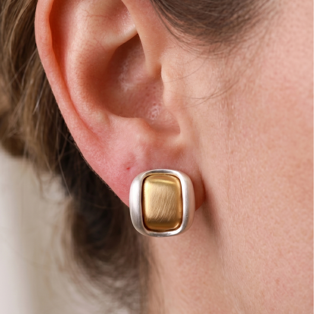 Two-tone brushed gold-plated square stud earrings, close-up of matte border and cushion centre