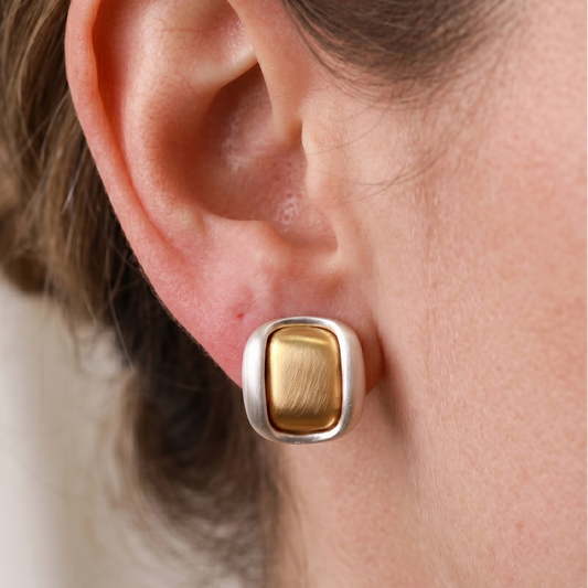 Two-tone brushed gold-plated square stud earrings, close-up of matte border and cushion centre