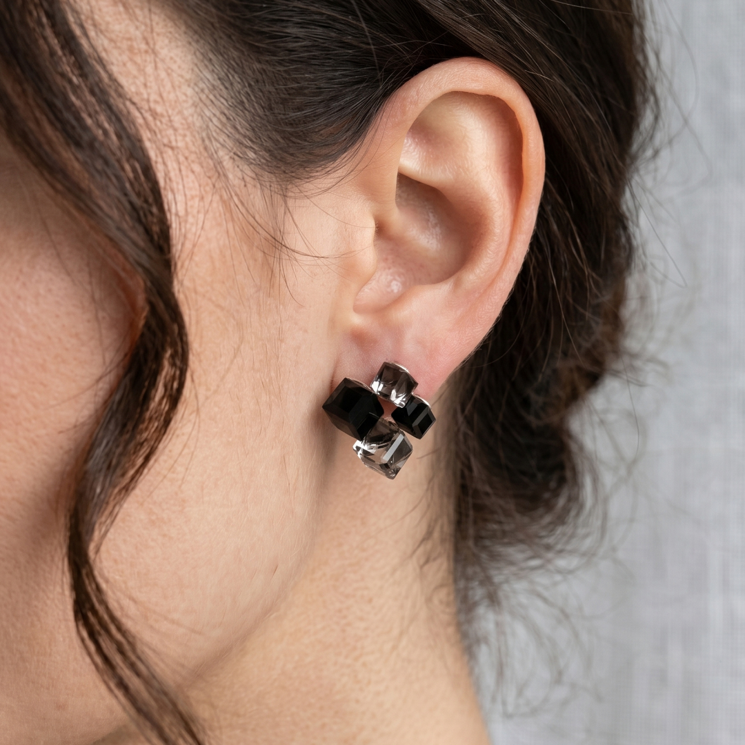 Faceted crystal cube cluster stud earrings in black and smoky grey, side view