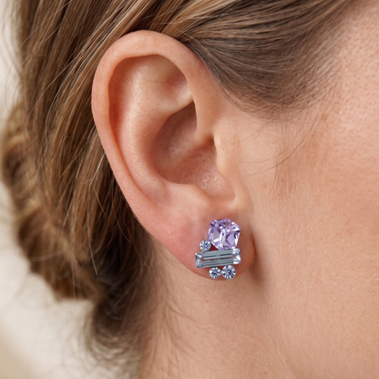 Close-up of mixed-cut crystal cluster earrings in lavender and blue, push-back posts