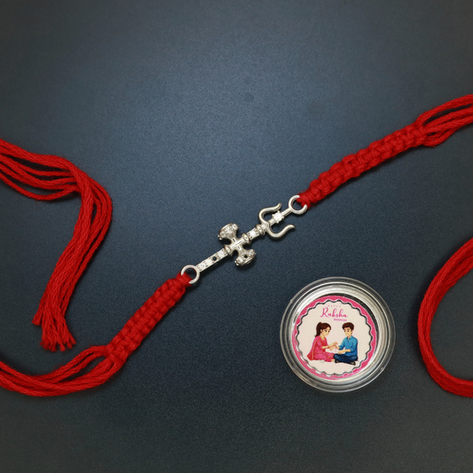 Sterling silver Trishul and Damru rakhi of Lord Shiva with zircon studding on red thread