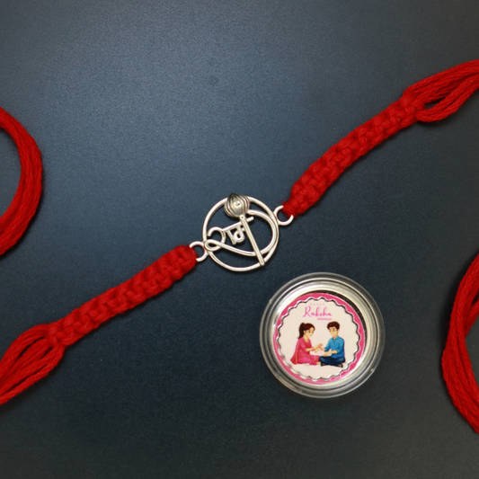Sterling silver Shree rakhi with kalash finial in wire-work on braided red thread