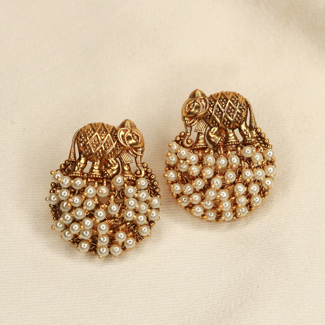 Antique gold-plated elephant stud earrings with white pearl cluster, handcrafted temple jewellery by Jija Jewellery Satara