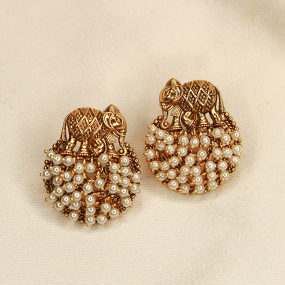 Antique gold-plated elephant stud earrings with white pearl cluster, handcrafted temple jewellery by Jija Jewellery Satara