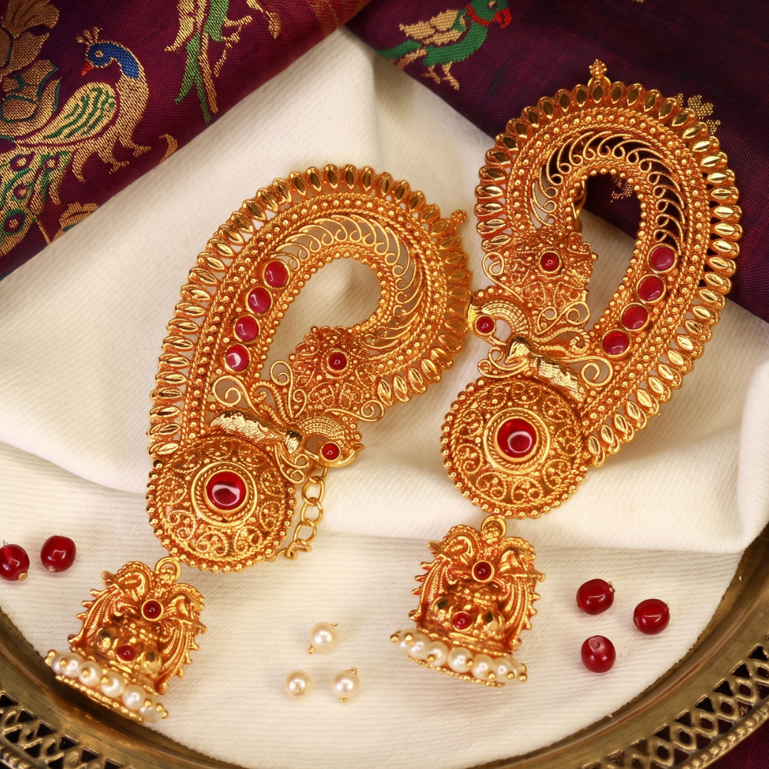 Antique gold-plated Maharashtrian paisley ear cuffs with ruby stones and pearl jhumka drops, handcrafted bridal temple jewellery by Jija Jewellery Satara