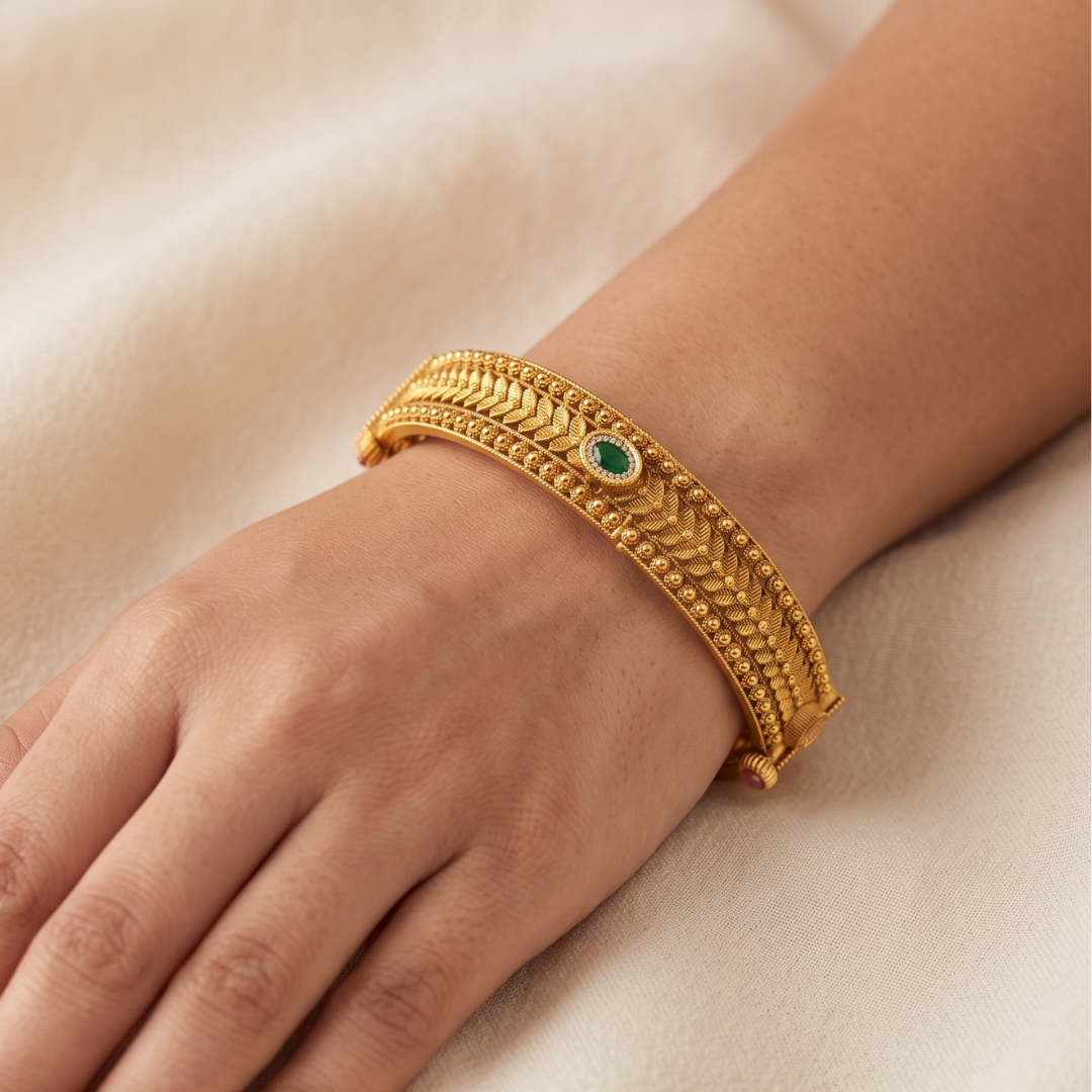 Antique gold plated kada bangles with ruby and emerald stones