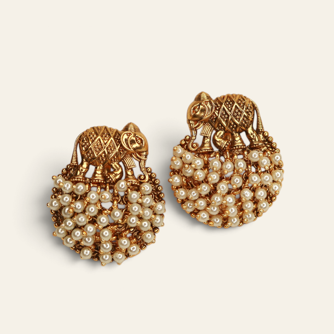 Antique gold-plated elephant stud earrings with white pearl cluster, handcrafted temple jewellery by Jija Jewellery Satara