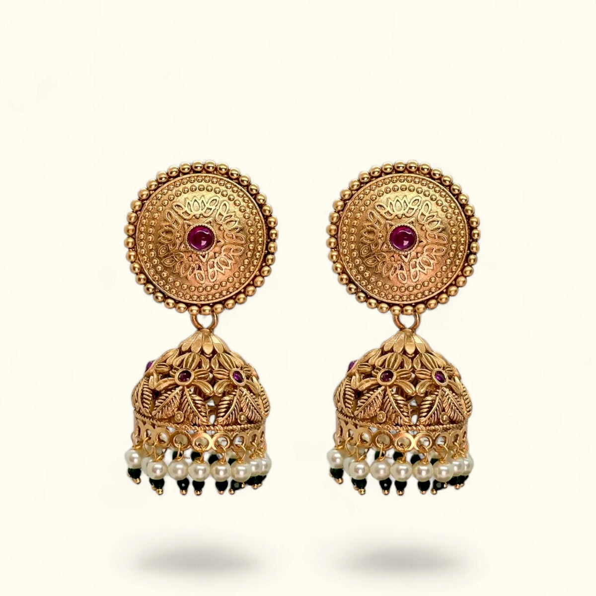 Gold plated jhumka earrings for women with floral round top, red stone and pearl drops – front view