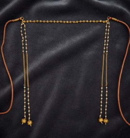 Gold plated moti Mundavalya with pearl strands and gold ball drops on dark velvet – handcrafted in Satara, India